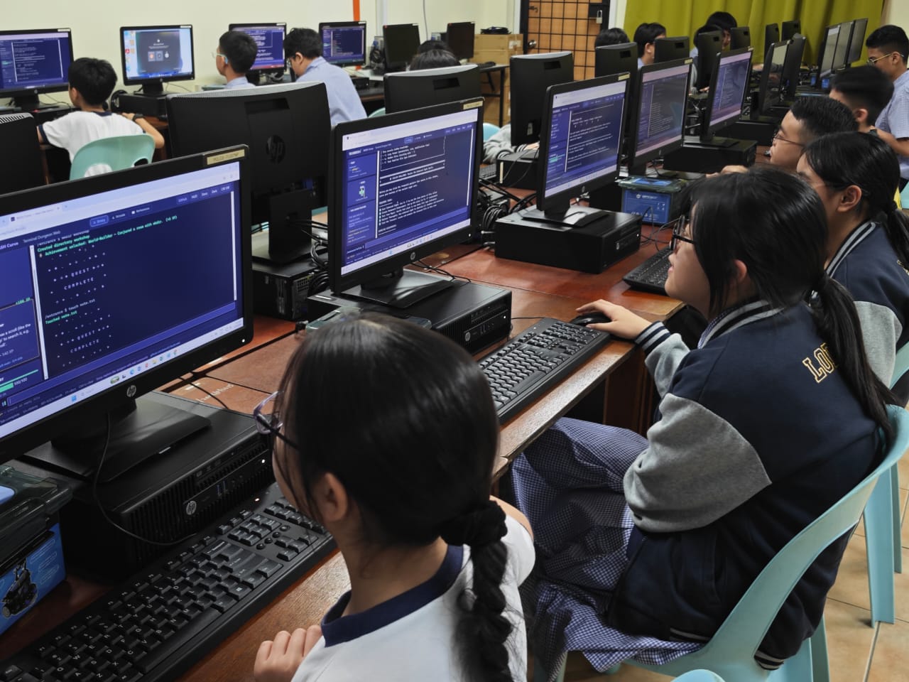 Students coding in a TLC computer lab