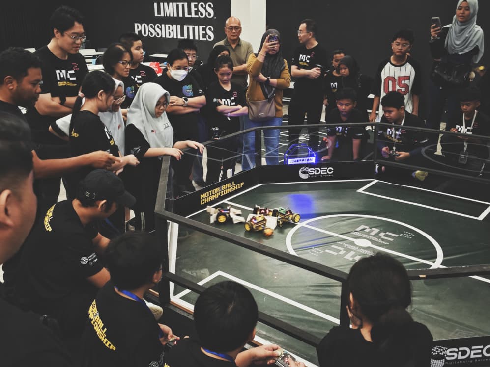 Students competing around the Motorball Championship pitch
